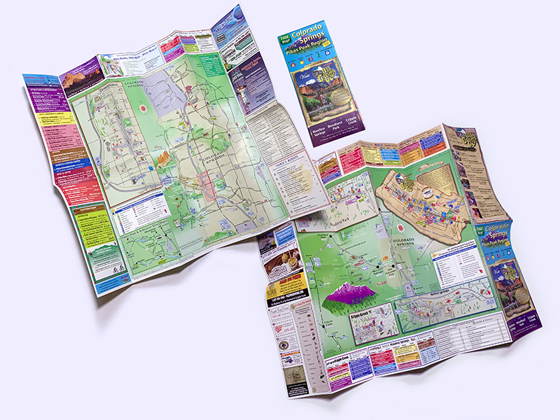front and back views of large unfolded print tourism map for Accent Maps in Colorado Springs and Pikes Peak area