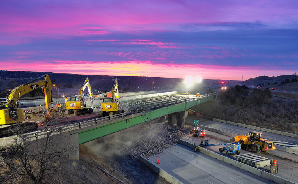 colorful sunrise photo of landscape focused on demolition of interstate bridge at South Academy Boulevard in Colorado Springs