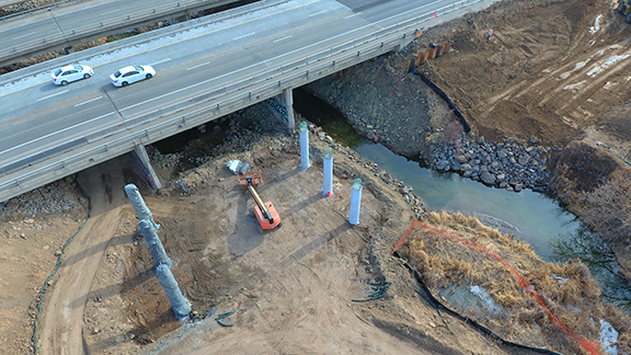 drone aerial photo of interstate bridge construction setting caissons