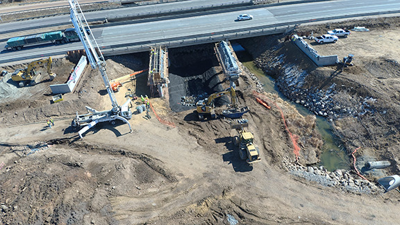 drone aerial image of I-25 bridge construction over Little Thompson River