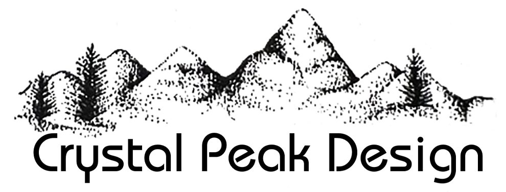 Crystal Peak's first logo, featuring a stippled illustration of a mountain range and the name Crystal Peak Design.